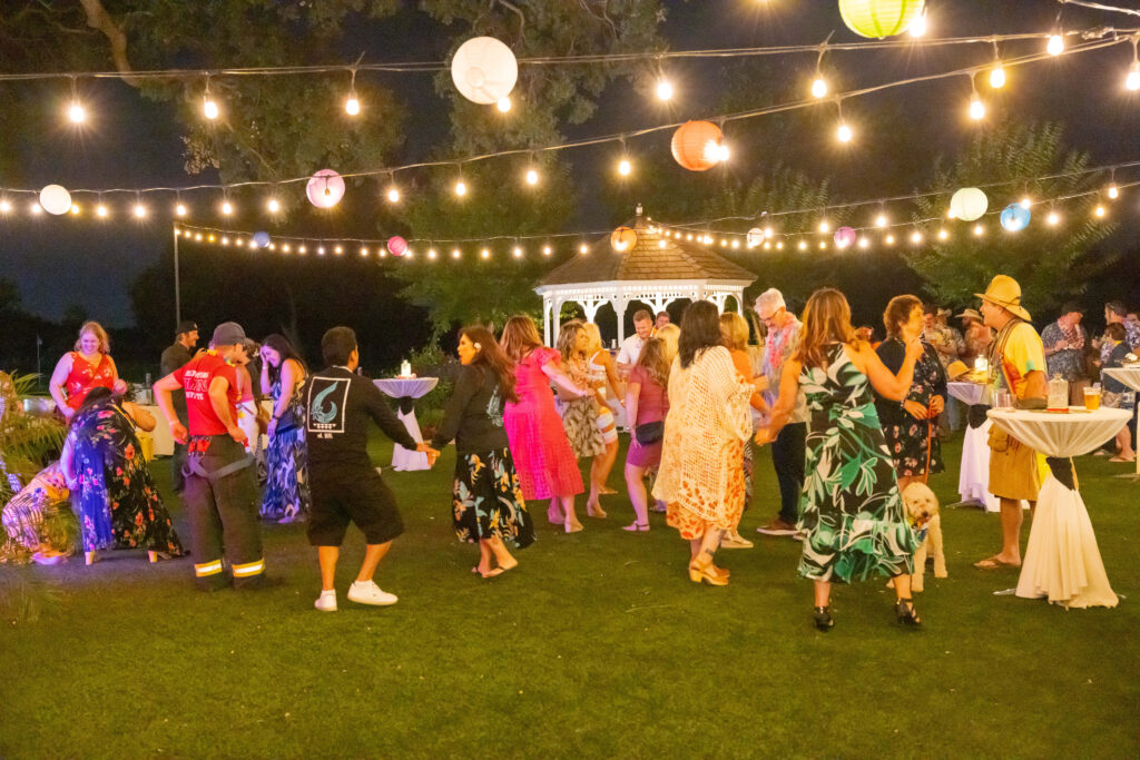 People dancing under lights
