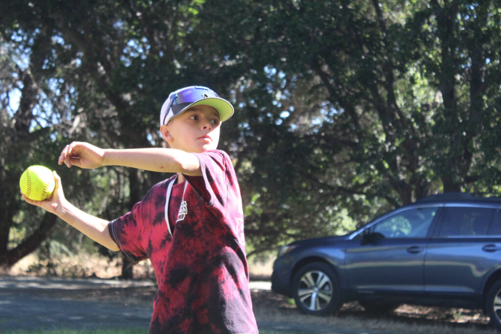 Kid about to throw a baseball