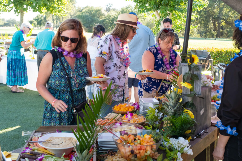 People getting food from food table