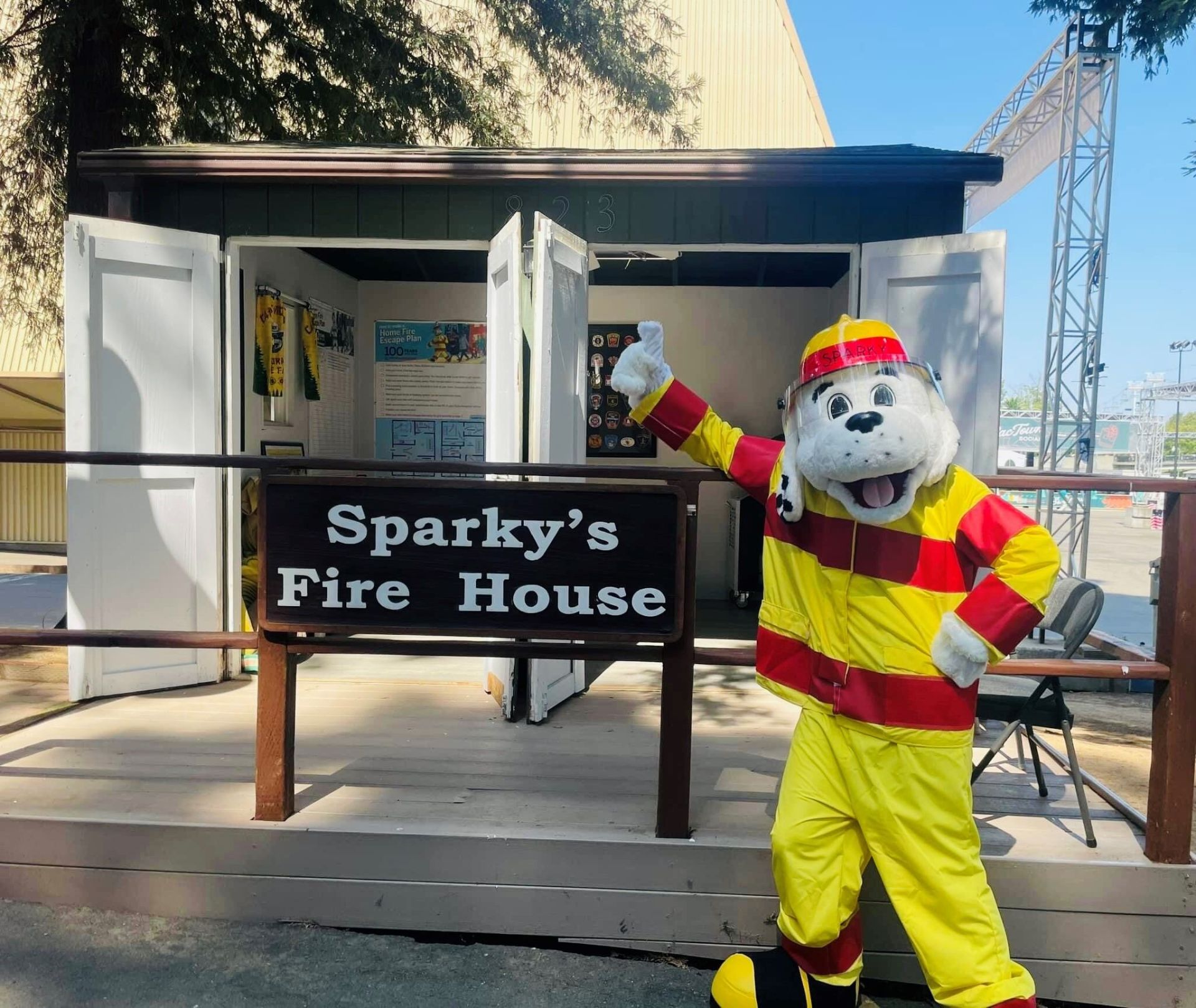 Sparky in front of Sparky's Fire House