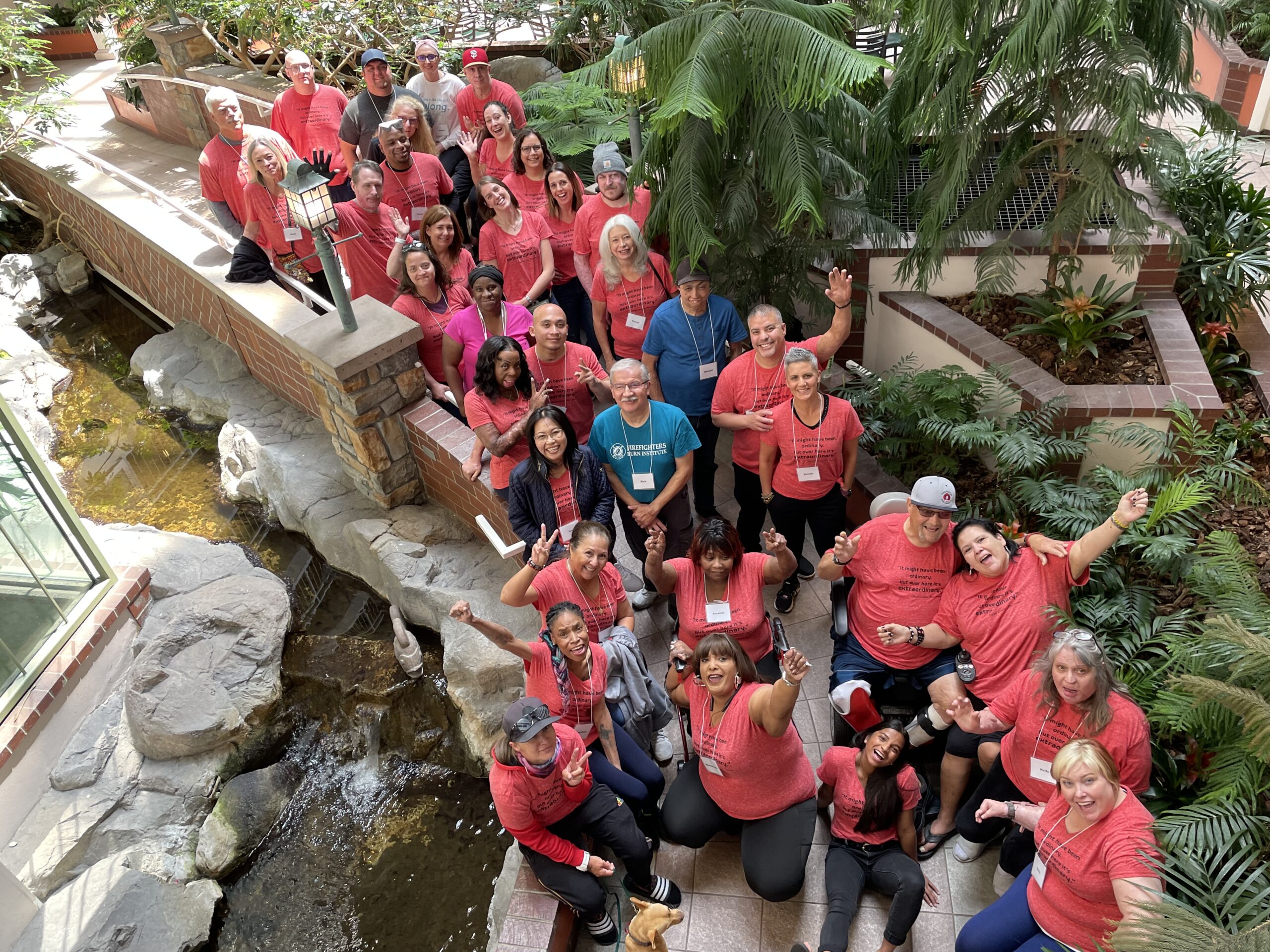 Group of burn survivors in red shirts