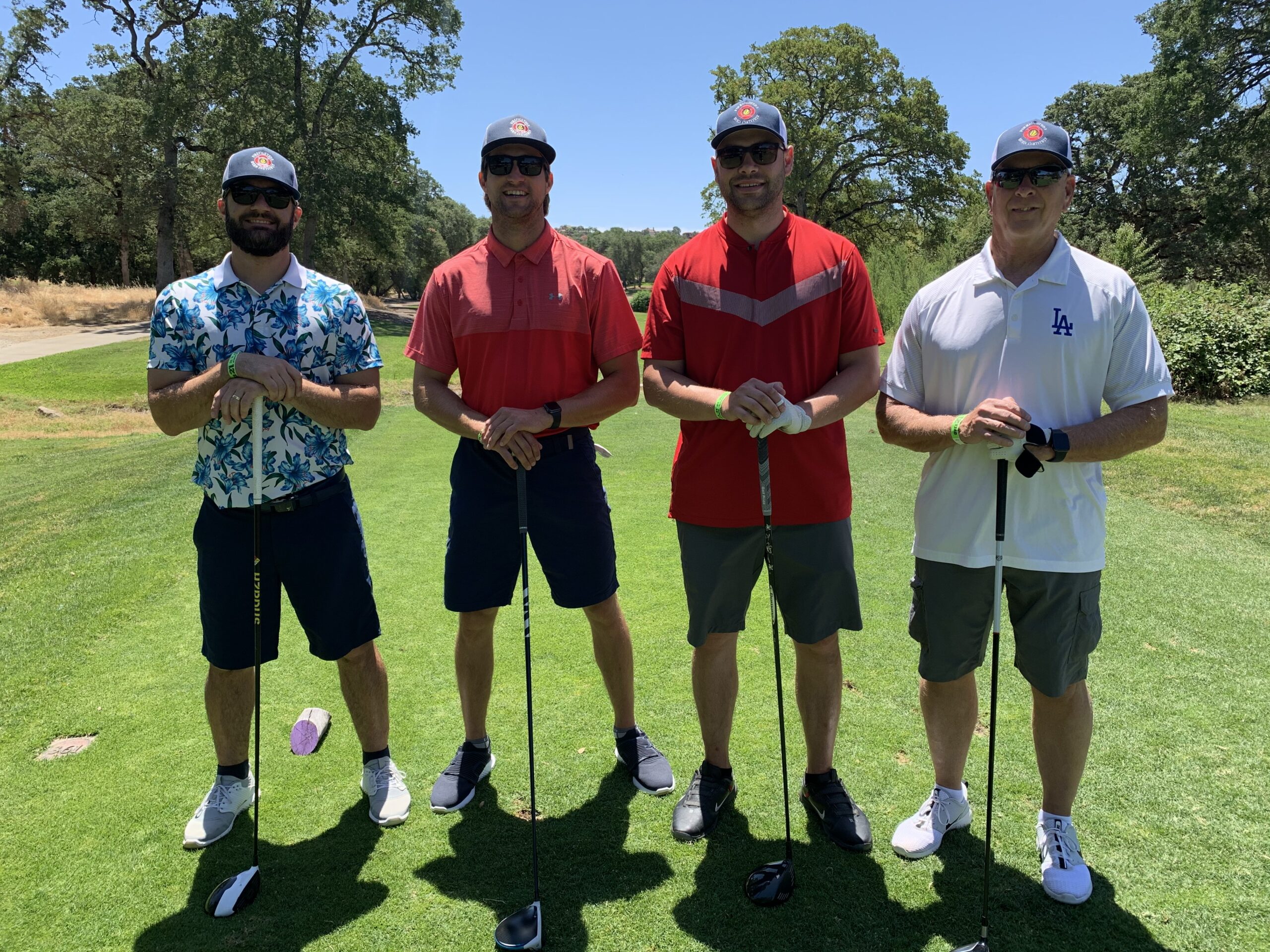 Group of 4 men on golf course